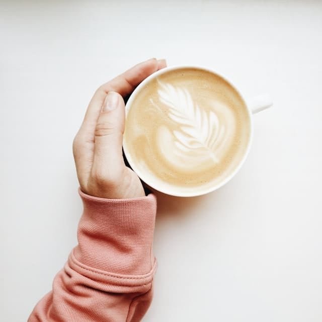 Rhonda Patrick holding her morning coffee