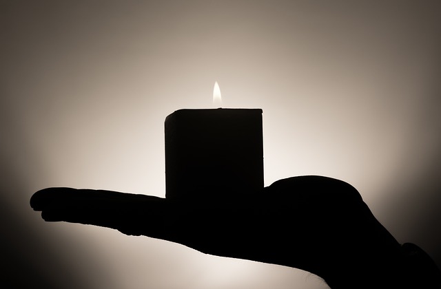 Closeup of Deepak Chopra holding a candle