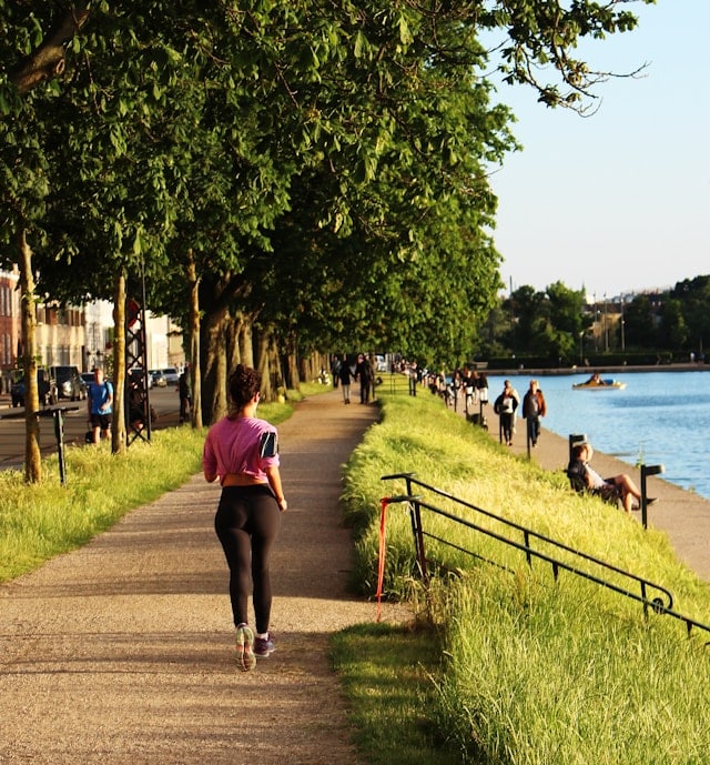 An athlete running near the lake
